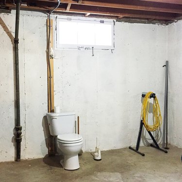 Open toilet in a basement