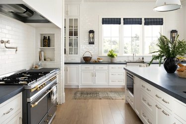 A white kitchen with black soapstone counters