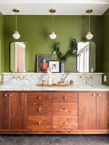 midcentury modern bathroom idea with green walls and marble countertop