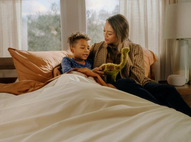 mom and son playing on Tuft & Needle bed