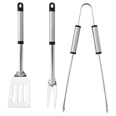 three barbecue tools - spatula, large fork, and tongs