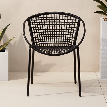 sleek minimal black rattan dining chair