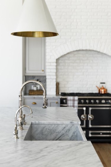 integrated marble kitchen sink in black and white traditional kitchen