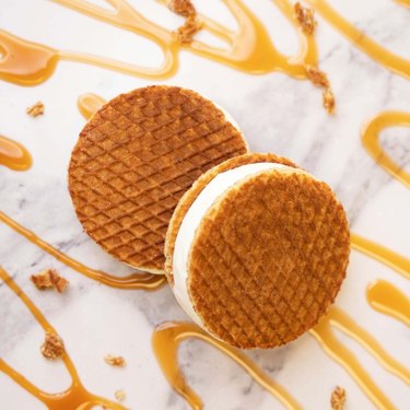 stroopwaffel ice cream sandwiches surrounded by caramel