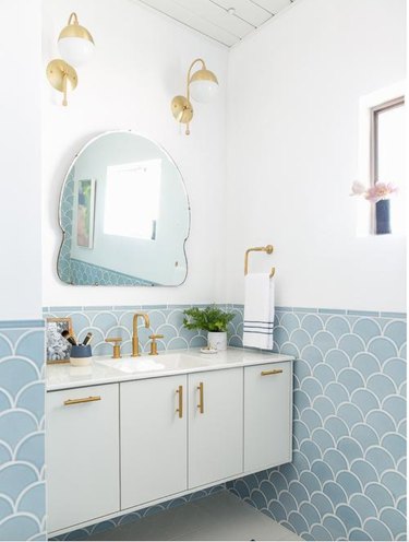 fish scale patterned wall tile in pale blue