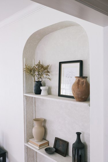 Built-in shelving area with Roman Clay finish