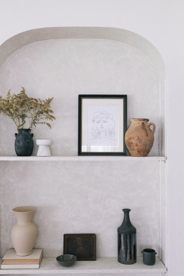 Built-in shelving area with Roman Clay finish