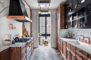 kitchen with black cupboards and copper accents