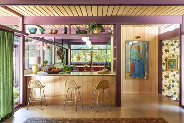 wood paneling with mauve beams and trim