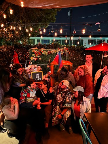 a group of people near a coffee cart