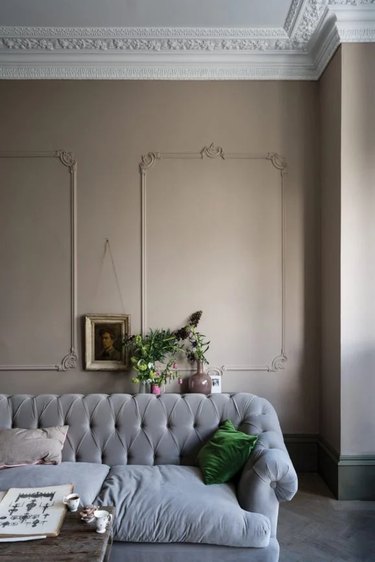 silver sofa with taupe wall paint color