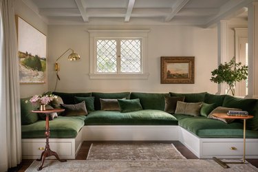 living room with built-in velvet sectional