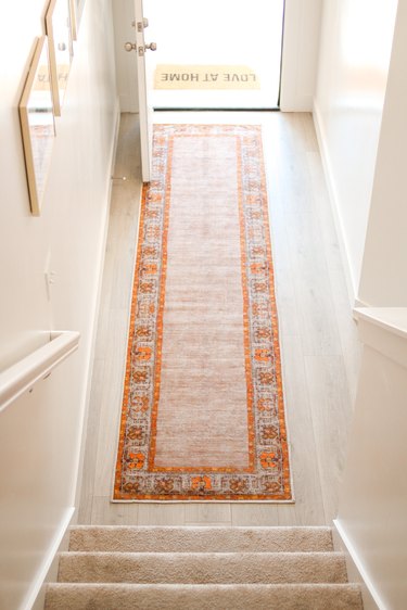 entryway of house with runner rug