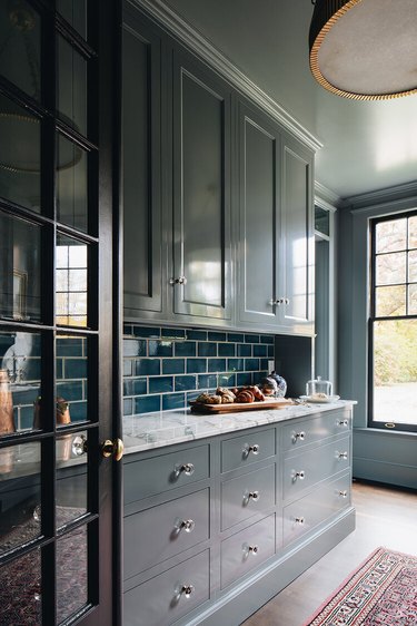 gray cabinets with teal backsplash tile