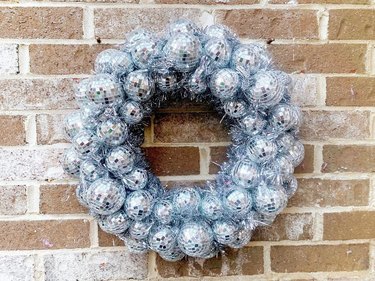 Disco Ball Wreath on brick wall