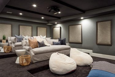 home theater with gray walls and brown carpet