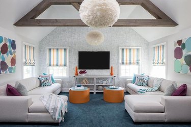 room with blue carpet and gray patterned wallpaper