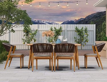 patio table with chairs and string lights