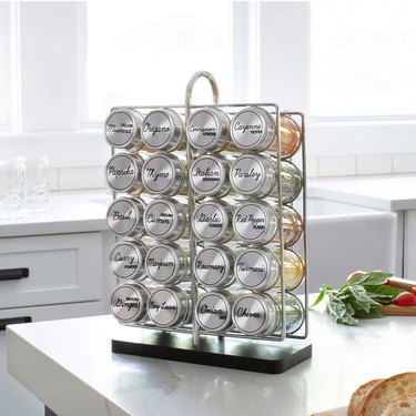 The Orii Jar Costco Spice Rack on a white countertop in a kitchen