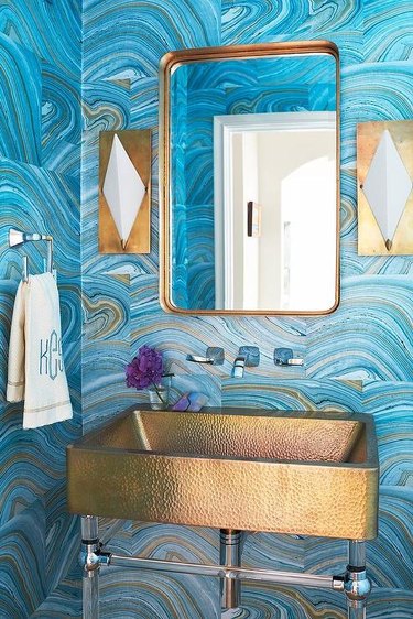 bathroom with copper sink and blue walls