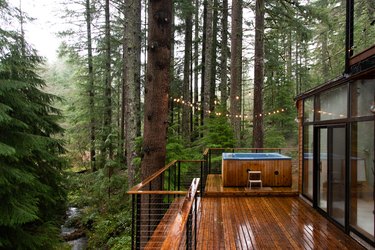 Hot tub on wood deck in forest