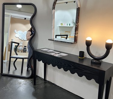 mirrors and console table with scalloped edges by Cam Design Co.