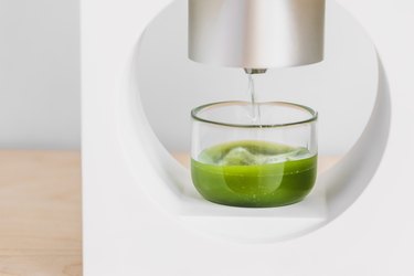 matcha machine pouring powder into water