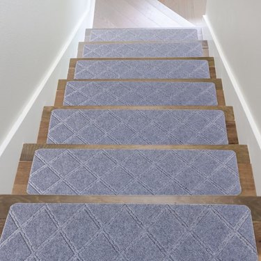 Stick-on carpet stair treads installed on wood stairs