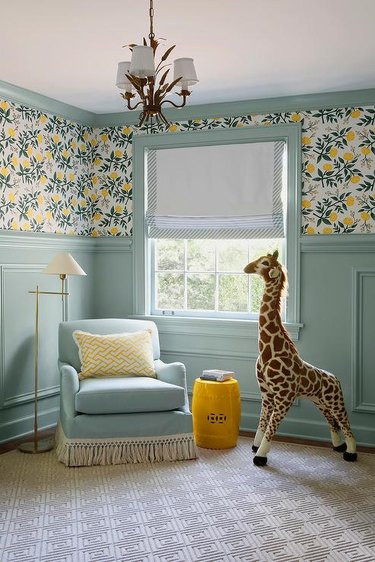 nursery with seafoam green paneling and trim and yellow accents