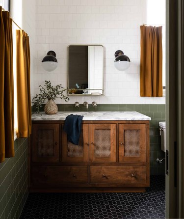 green and white bathroom with mustard yellow curtains