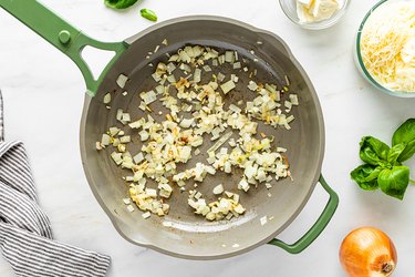 Cooking onions and garlic in a large pan