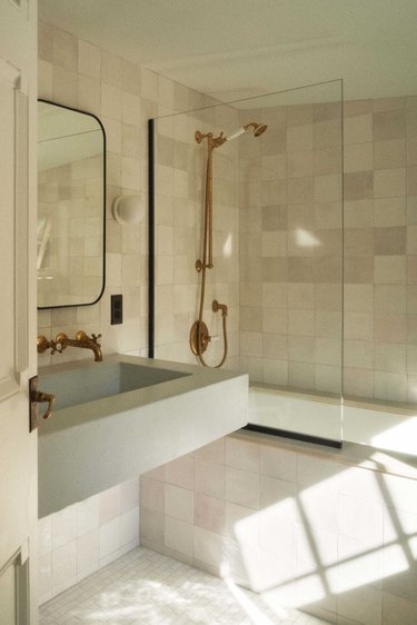 small primary bath features a white color palette