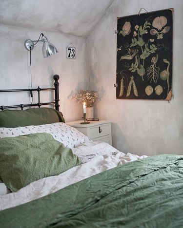 bedroom with botanical-print poster on wall