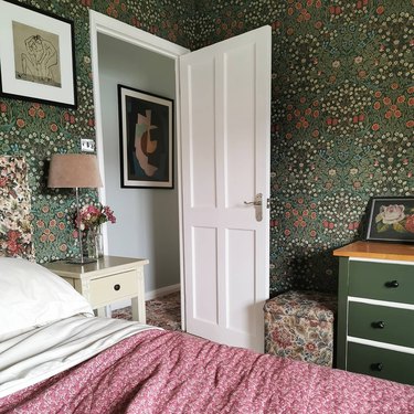 bedroom with green floral wallpaper