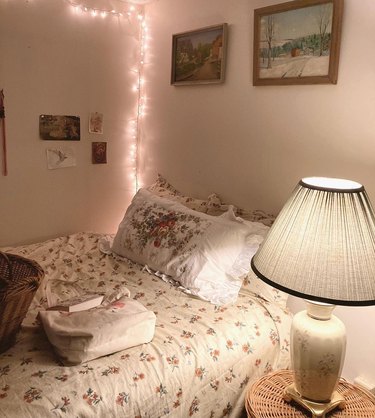 bedroom with fairy lights hanging in one corner