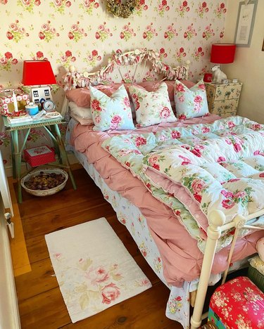 bedroom with all-over floral decor and house-shaped table lamps