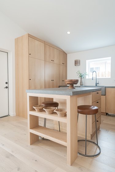minimalist kitchen island light wood cabinets and shelving