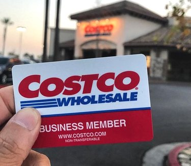 costco card in front of costco store