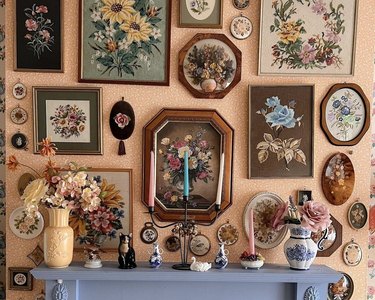 gallery wall on peach backdrop with blue fireplace