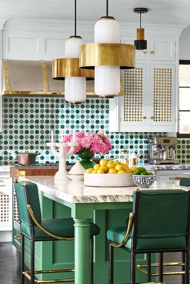 Green kitchen island and backsplash