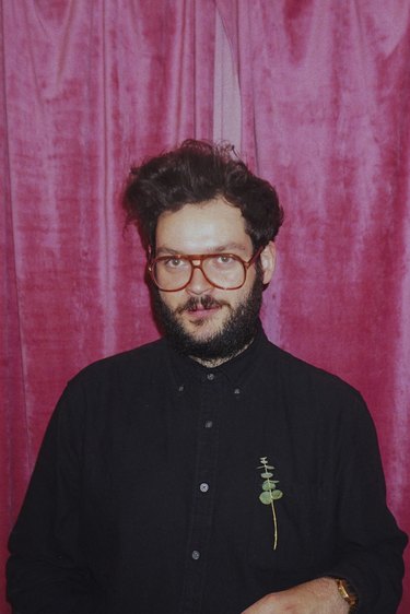 photo of a person with red backdrop