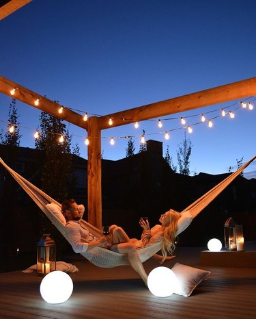 pergola hammock with string lights