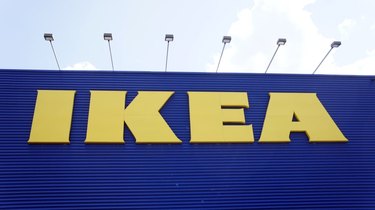 A large IKEA storefront sign with yellow lettering and a royal blue background.