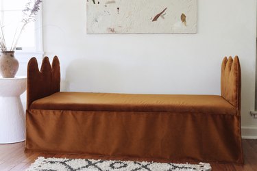 DIY wavy bench daybed with copper velvet fabric with abstract artwork hung above
