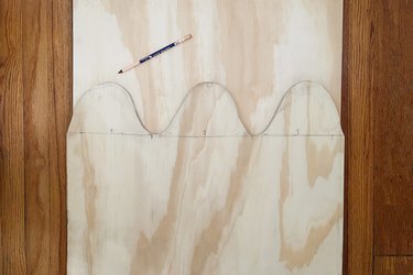 Tracing wavy shape onto second piece of plywood