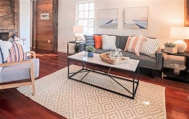 Gray sofa with neutral rug