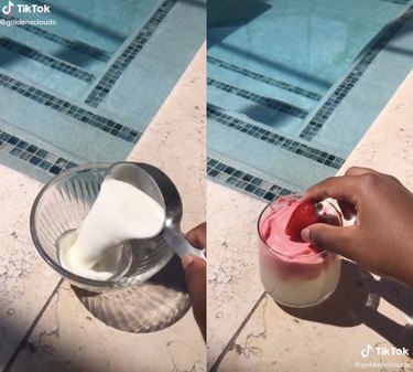 two screenshots of a TikTok video near a pool with person making something in bowl and putting a strawberry on pink whipped lemonade drink