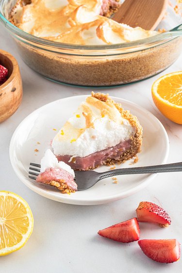 Slice of strawberry citrus meringue pie