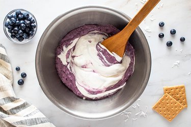 Combine whipped topping and blueberry cream