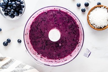 Puree blueberries and yogurt in a food processor